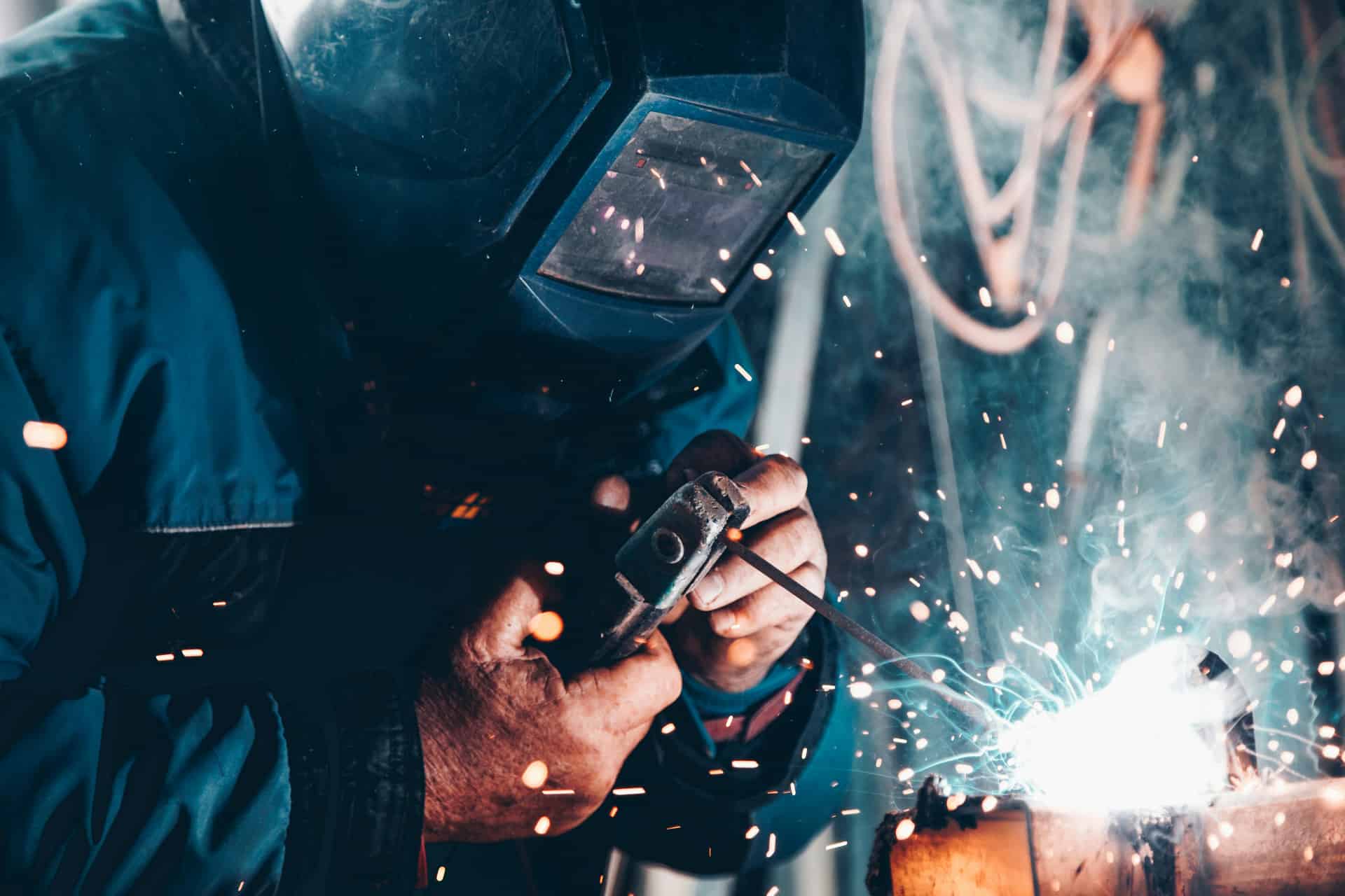 Technician welding metal components