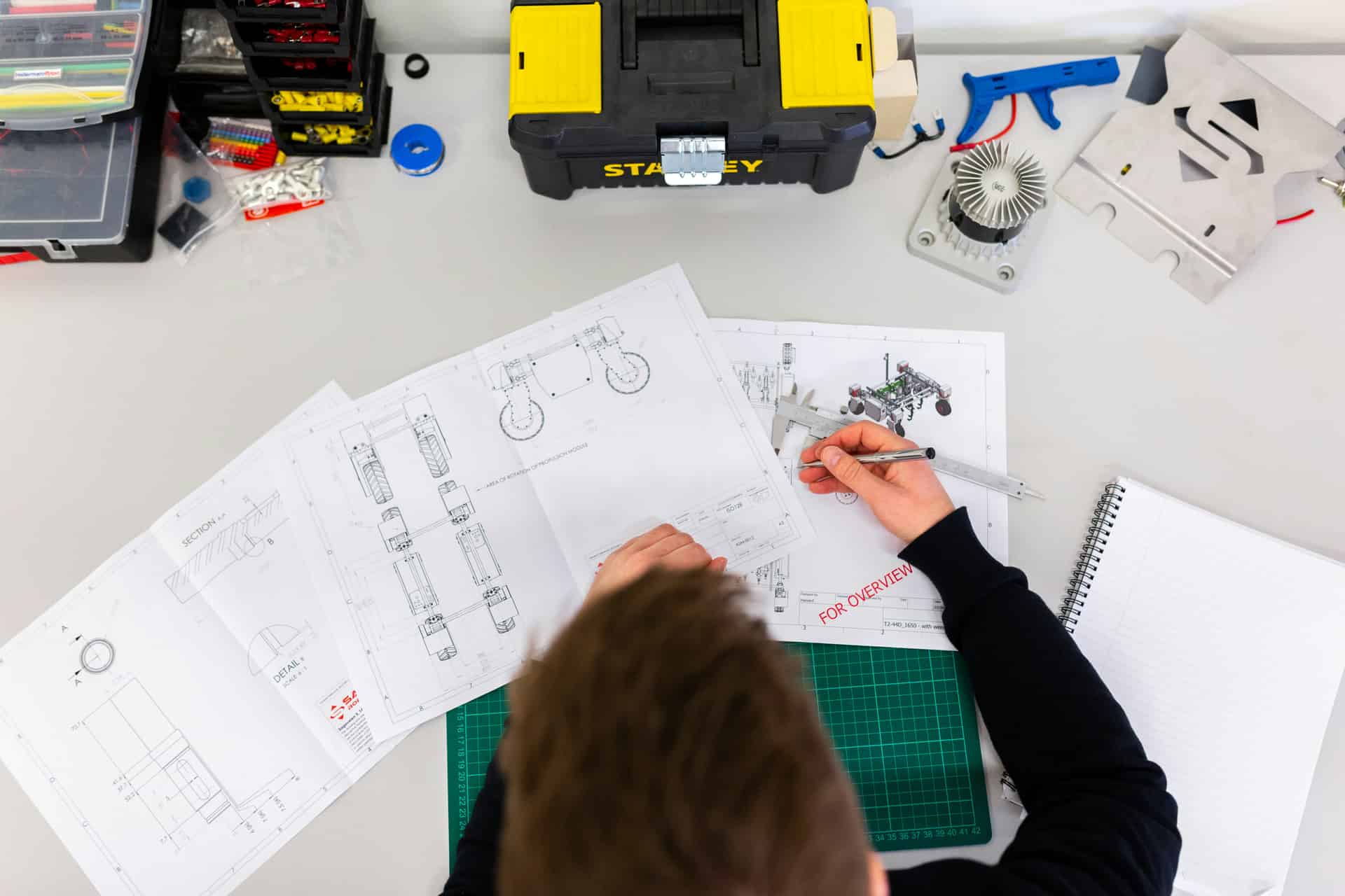 Engineer reviewing mechanical drawings